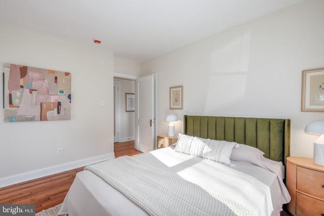 bedroom featuring wood-type flooring