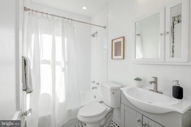 full bathroom with tile patterned flooring, vanity, shower / tub combo, and toilet