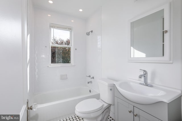 full bathroom featuring vanity, tiled shower / bath combo, toilet, and tile patterned flooring