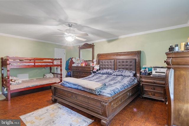 bedroom with dark hardwood / wood-style floors, ceiling fan, and crown molding