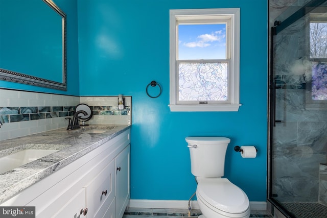 bathroom featuring backsplash, tile patterned floors, an enclosed shower, vanity, and toilet