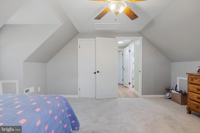 carpeted bedroom with ceiling fan and lofted ceiling