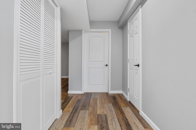 corridor featuring dark hardwood / wood-style floors