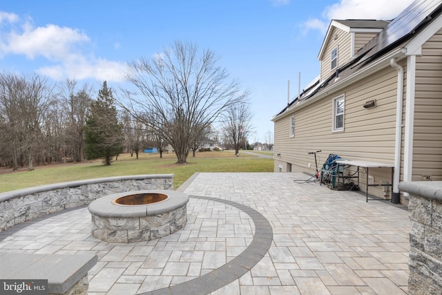 view of patio featuring a fire pit