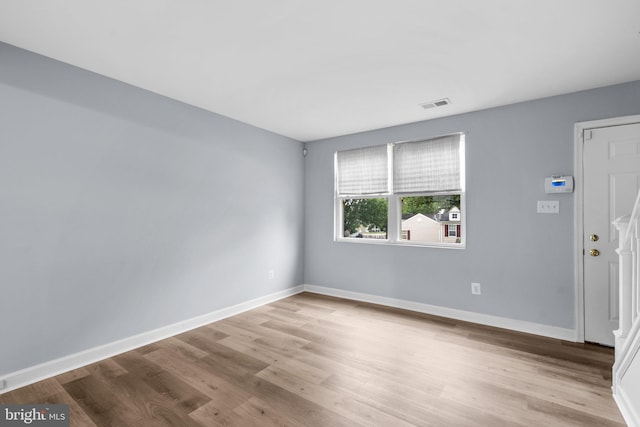 empty room with light wood-type flooring