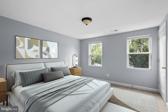 bedroom with light carpet