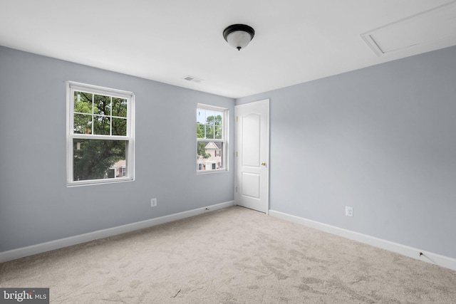 spare room with light colored carpet