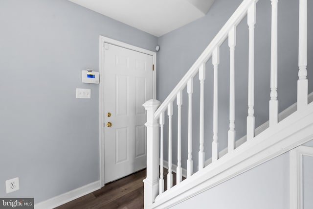 foyer entrance with dark wood-type flooring