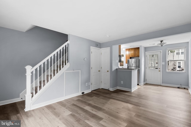 unfurnished living room with light hardwood / wood-style floors