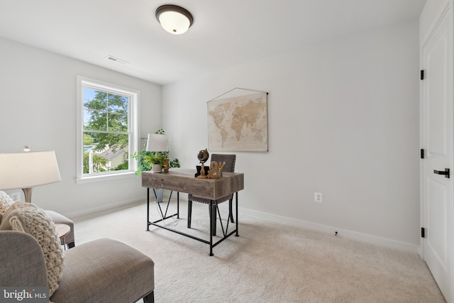 office area featuring light colored carpet