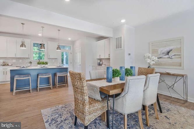 dining room featuring light hardwood / wood-style floors