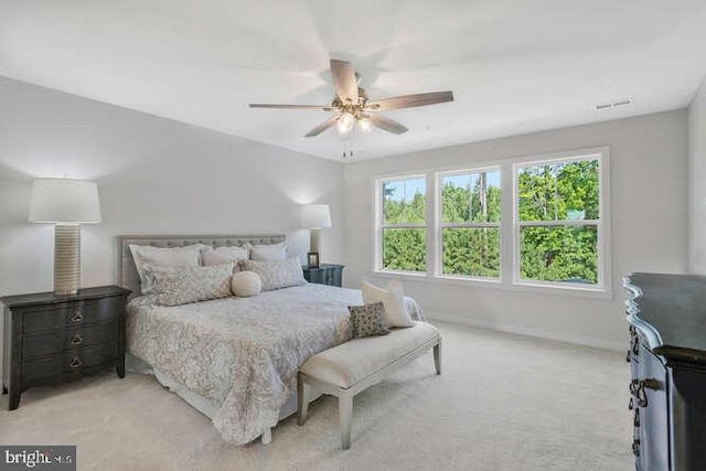 bedroom with light carpet and ceiling fan