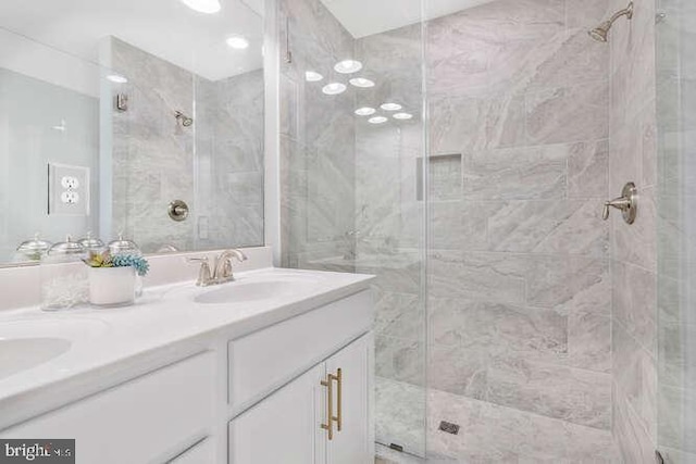 bathroom featuring vanity and an enclosed shower