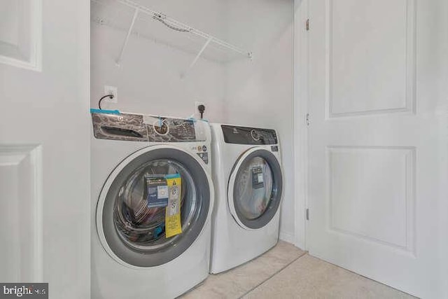 washroom featuring separate washer and dryer