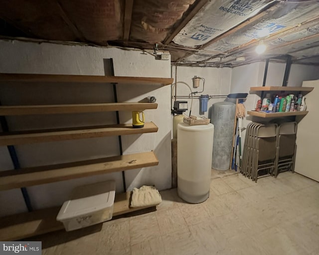 basement with white fridge