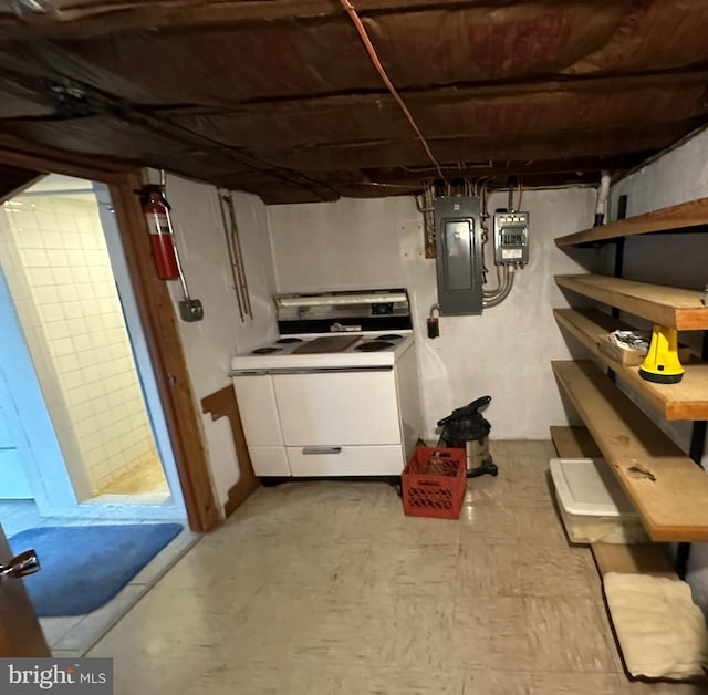 basement featuring electric panel and washer / clothes dryer