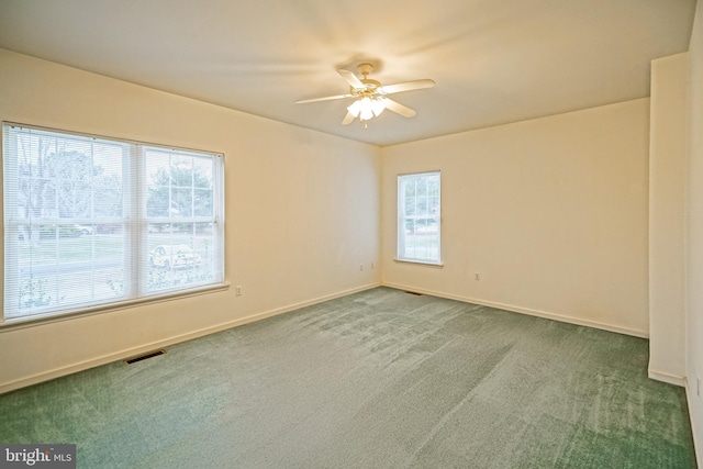 carpeted empty room with ceiling fan