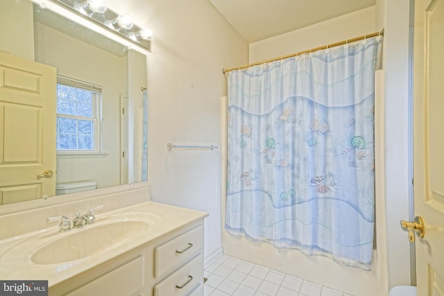 full bathroom with tile patterned floors, vanity, toilet, and shower / tub combo