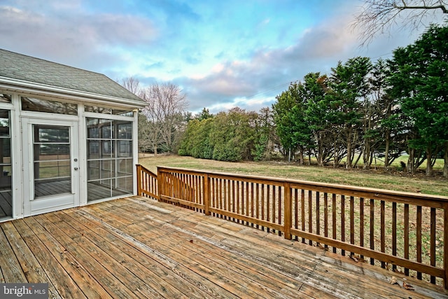 wooden terrace featuring a sunroom