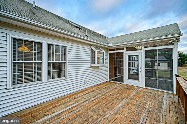 wooden terrace with a sunroom