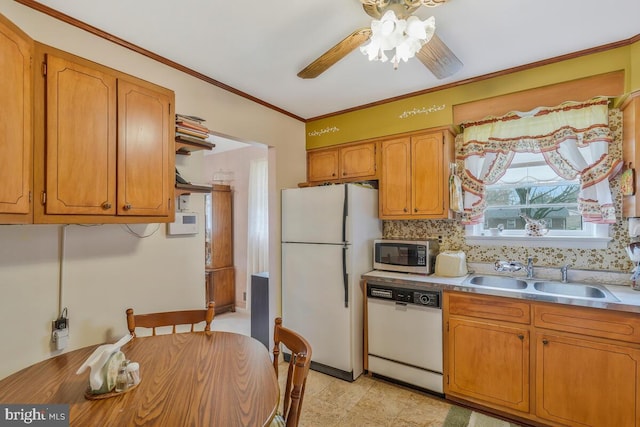 kitchen with white appliances, crown molding, sink, ceiling fan, and tasteful backsplash