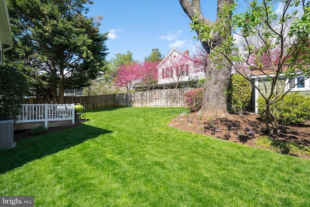 view of yard featuring central AC