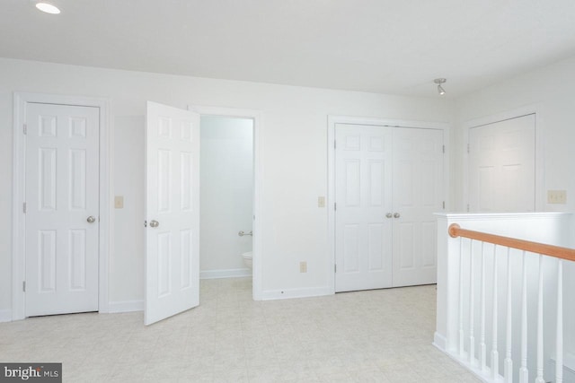 unfurnished bedroom featuring ensuite bath