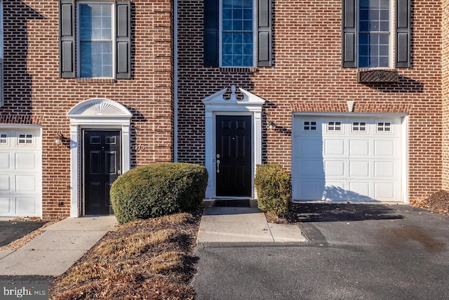 entrance to property featuring a garage