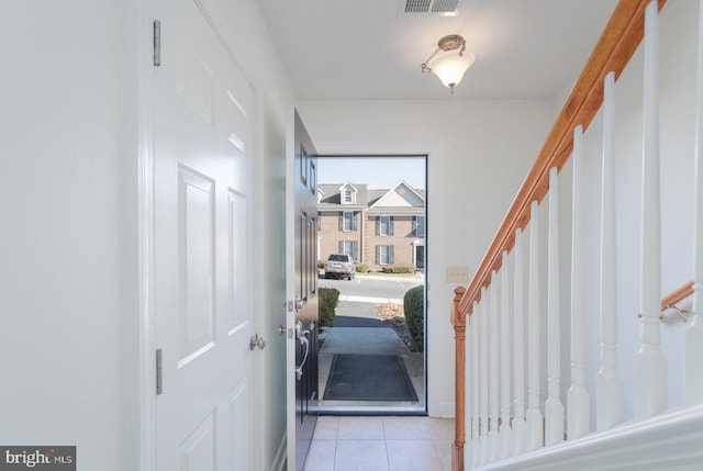 entrance foyer featuring light tile patterned floors