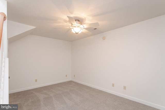 spare room with light carpet and ceiling fan