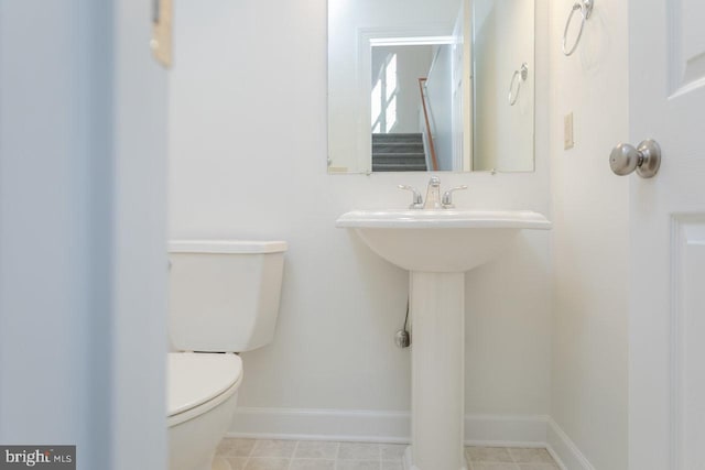 bathroom featuring tile patterned floors and toilet