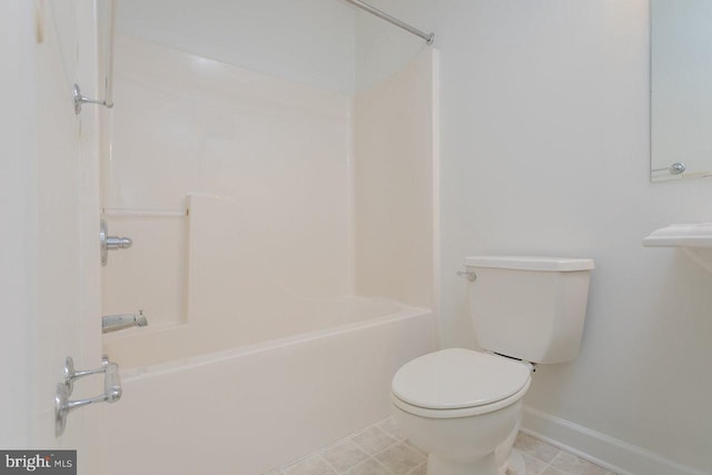 bathroom featuring bathing tub / shower combination and toilet