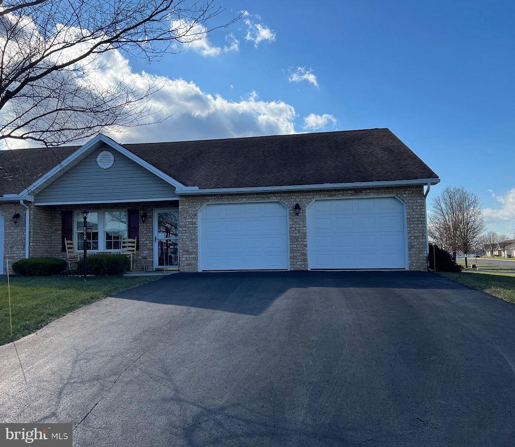 single story home featuring a garage