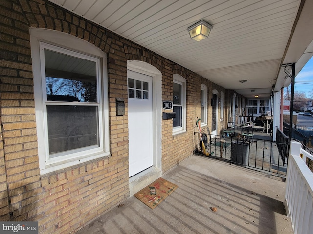 wooden terrace with a porch