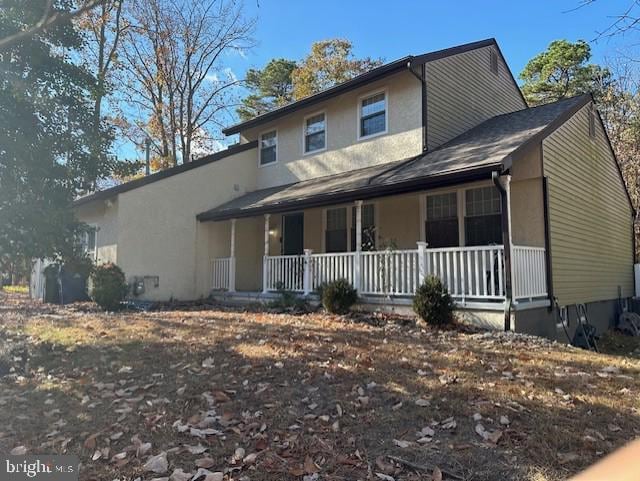 view of front of property featuring covered porch