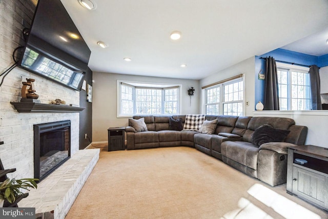 carpeted living room with a fireplace