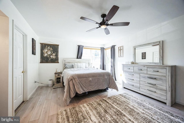 bedroom with ceiling fan and light hardwood / wood-style floors