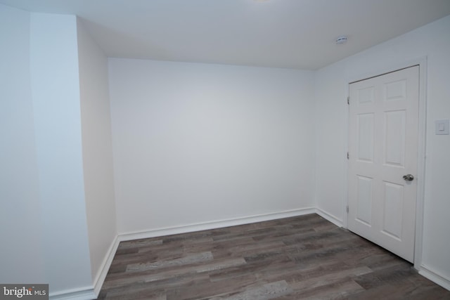 spare room featuring dark hardwood / wood-style flooring