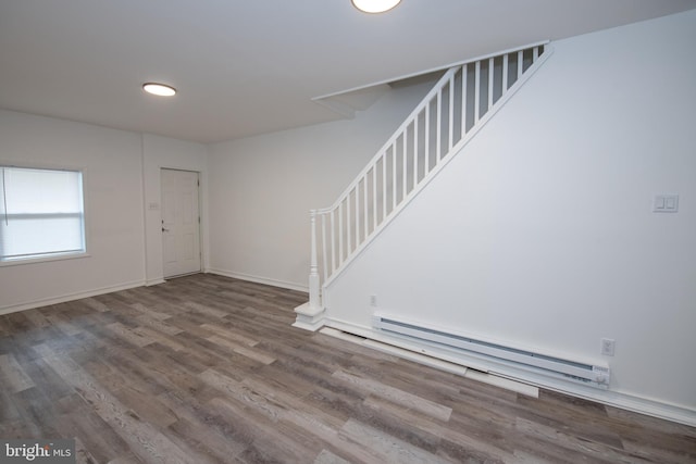 entrance foyer featuring hardwood / wood-style floors and baseboard heating