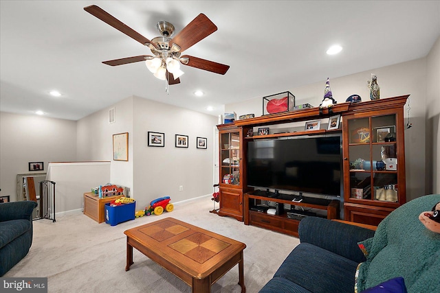 carpeted living room featuring ceiling fan