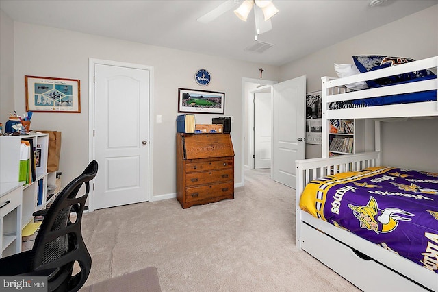 carpeted bedroom with ceiling fan