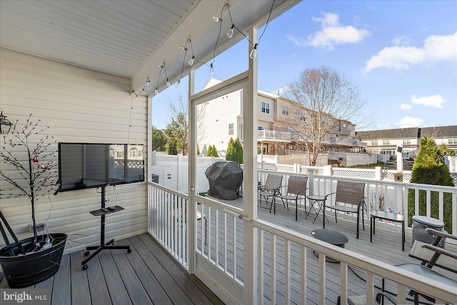 wooden deck with grilling area