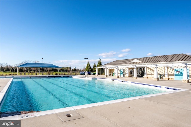 view of swimming pool featuring a patio