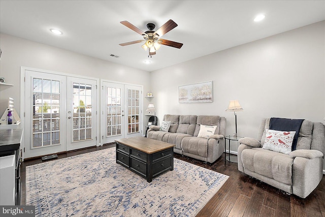 living room with ceiling fan, french doors, and dark wood-type flooring