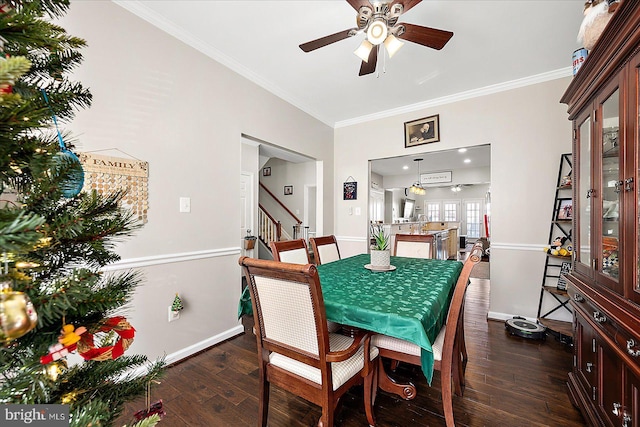 dining area with crown molding, ceiling fan, and dark hardwood / wood-style floors