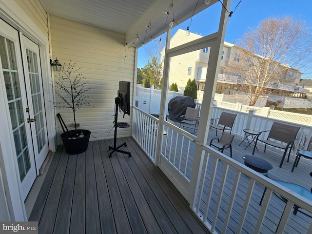 deck featuring grilling area and french doors