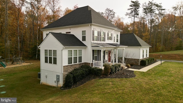 view of front of house with a porch and a front lawn