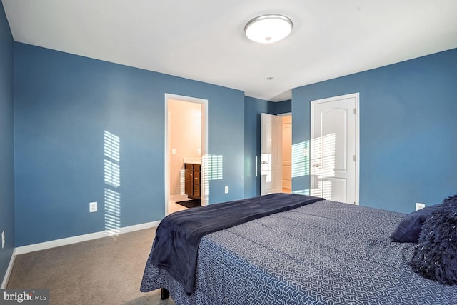 bedroom with carpet and ensuite bathroom