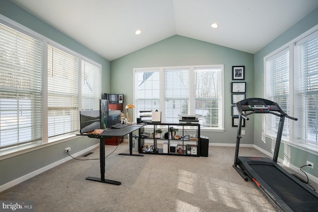 exercise room featuring carpet, plenty of natural light, and lofted ceiling