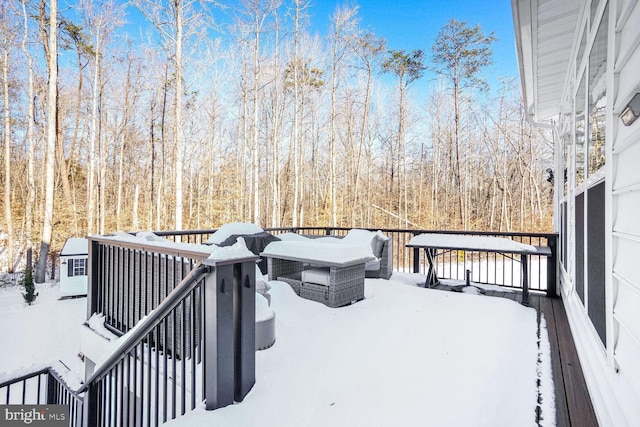 view of snow covered deck